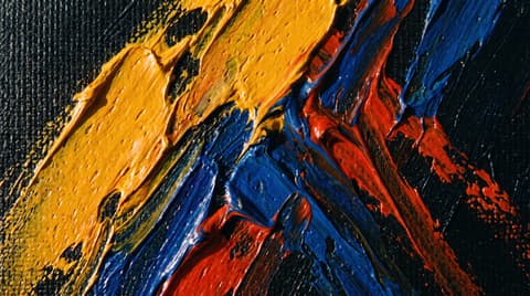 Macro detail of thick impasto oil paint in marigold, cobalt and vermilion across a dark ground.
